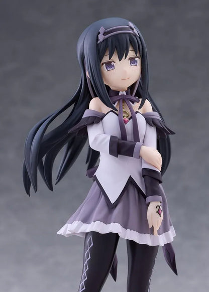 Homura Akemi figure with long black hair, violet eyes, a white and purple outfit, and diamond-patterned stockings, smiling with one hand resting on her arm.