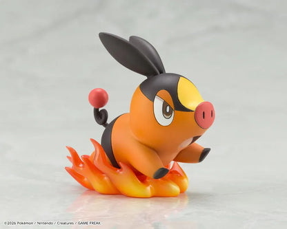 Pokemon ArtFX J Hilda with Tepig 1/8 Scale Figure Rerun featuring Hilda in her trainer outfit holding a Poké Ball with Tepig and flame effect on a display base.