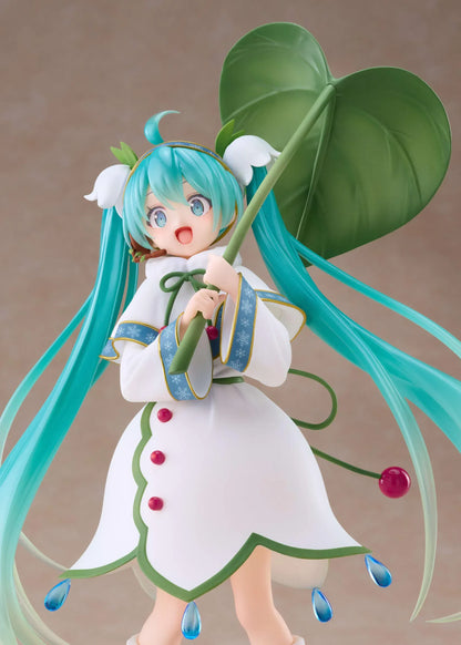 Snow Miku All Stars 2015 Ver. AMP+ figure wearing a white flower-inspired dress and holding an oversized green leaf.