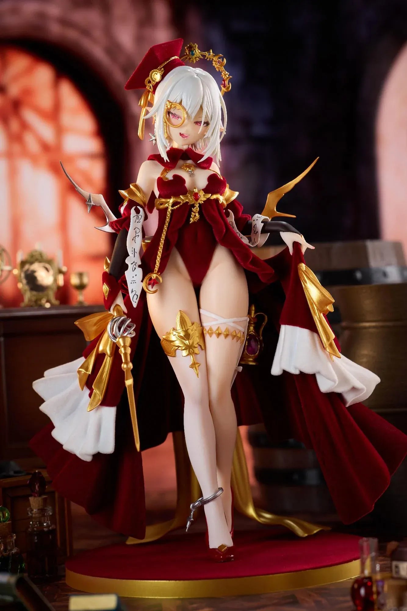 Alchemist Formal Dress Ver. 1/7 Scale Figure featuring a white-haired character in a red formal dress with gold accessories, ornate staff, cape, and red display base.