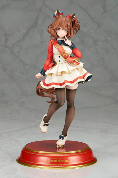 UmaMusume Pretty Derby Aston Machan 1/7 Scale Figure featuring Aston Machan with horse ears, short brown hair, red-and-cream outfit, plush doll accessory, and themed display base.