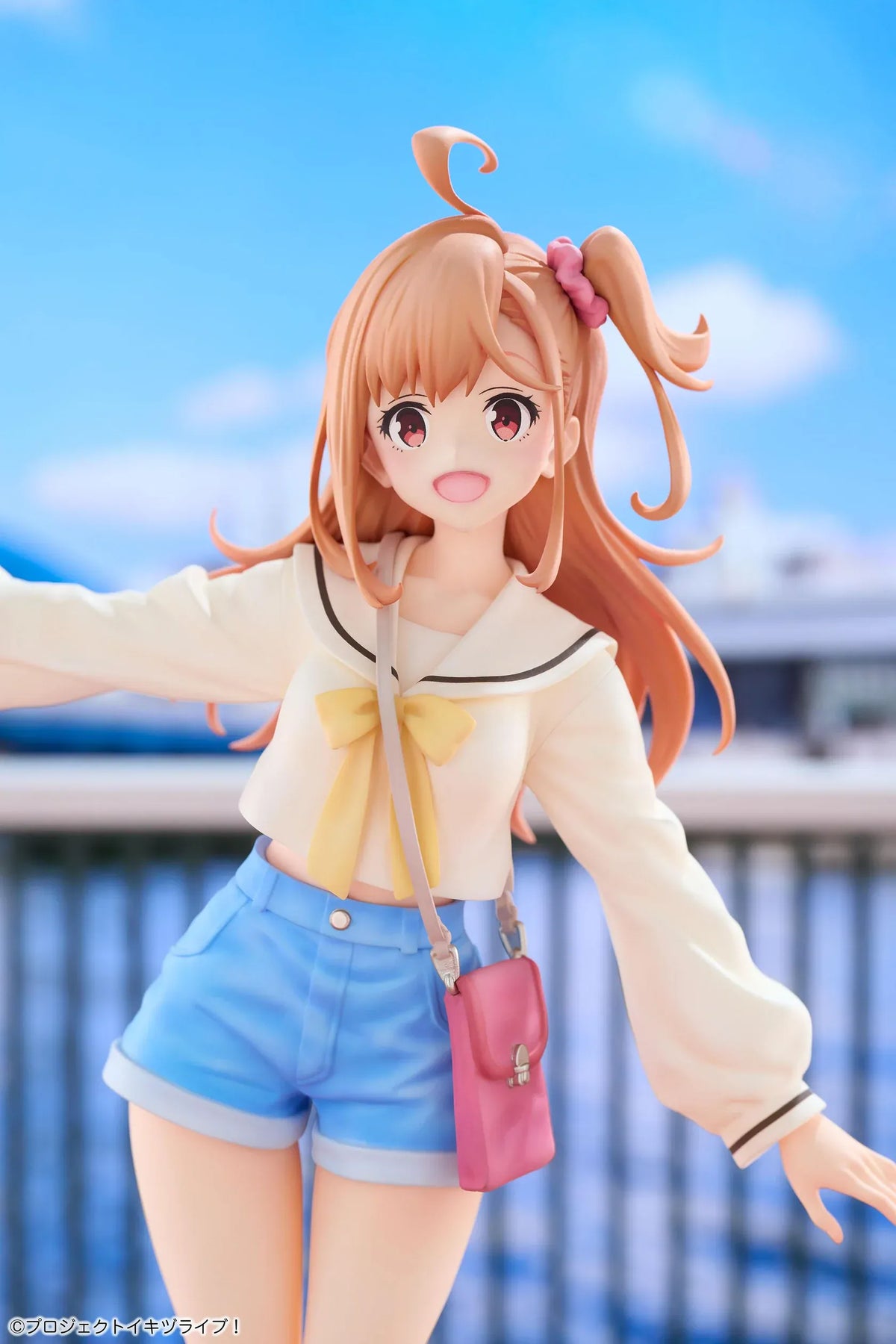 Polka Takahashi 1/7 scale figure with orange hair, a white sailor-style top, blue shorts, and a pink shoulder bag, posed on a yellow base.