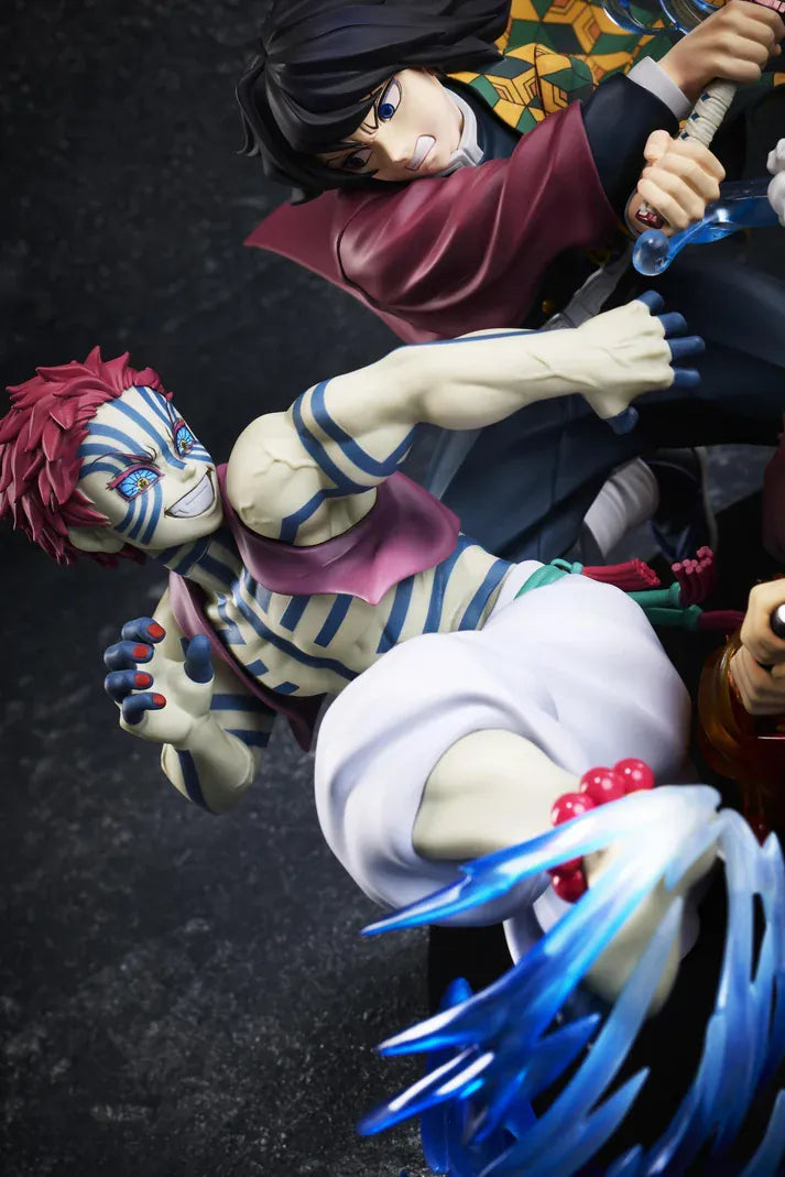 Demon Slayer Tanjiro Kamado, Giyu Tomioka, and Akaza vignette figure featuring translucent water and fire battle effects.