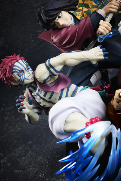 Demon Slayer Tanjiro Kamado, Giyu Tomioka, and Akaza vignette figure featuring translucent water and fire battle effects.