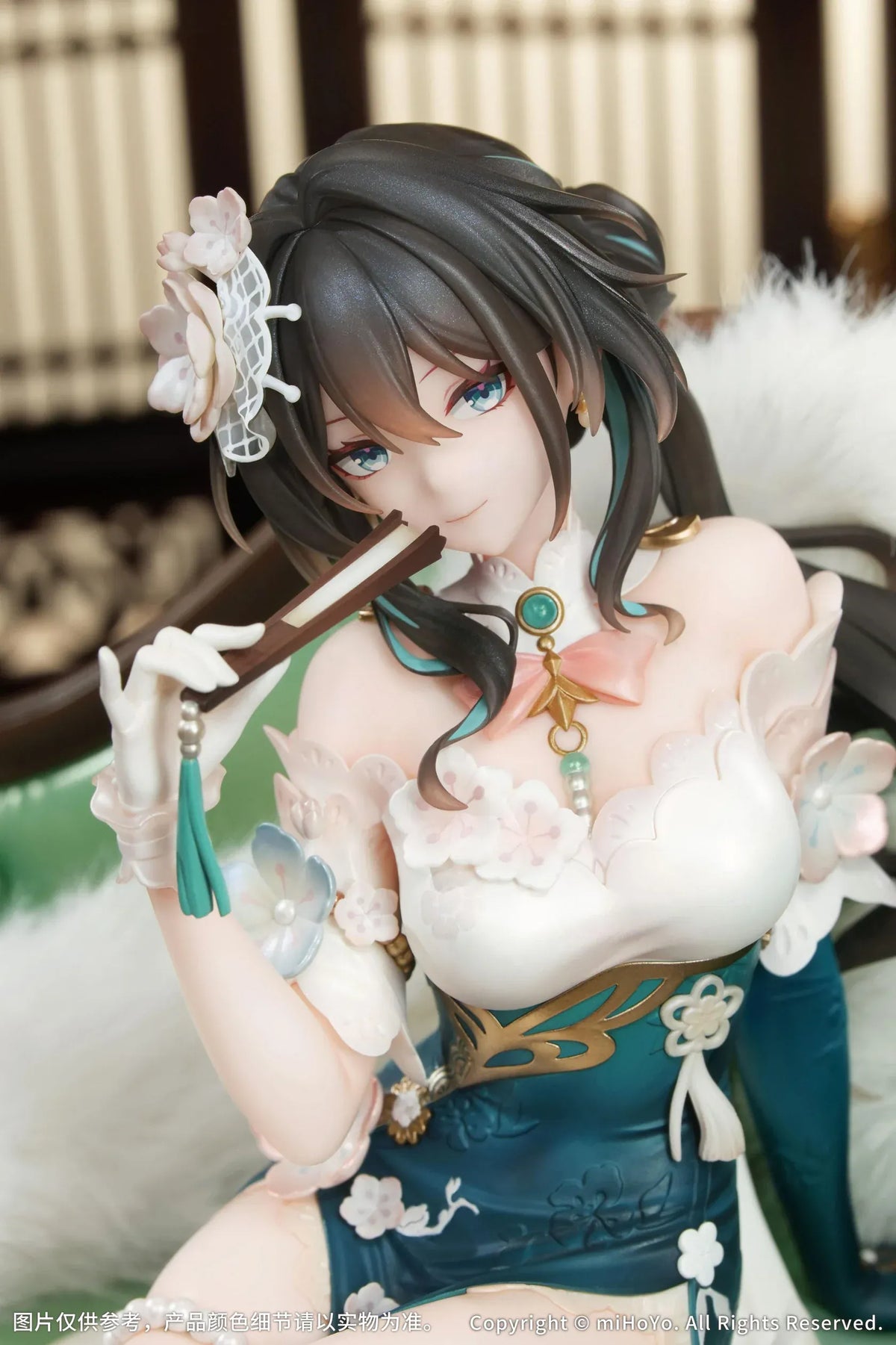 Ruan Mei Plumblossom Letter 1/7 scale figure wearing an elegant teal-and-white floral dress while seated on an ornate green sofa.
