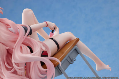 Blue Archive Kirara figure with long pink hair, black horns, and a pink halo, seated on a classroom desk beside nail polish bottles.