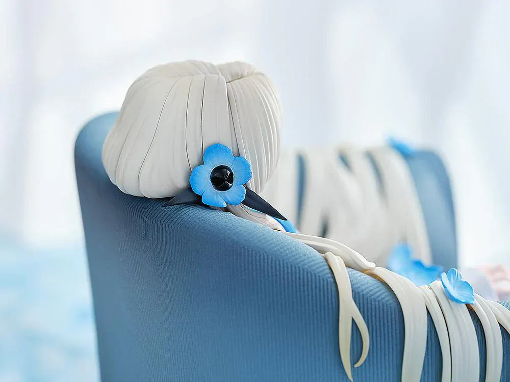 Isekaijoucho Universal Body Nemophila 1/7 scale figure sitting on blue chair with flowing silver hair and blue flower petals