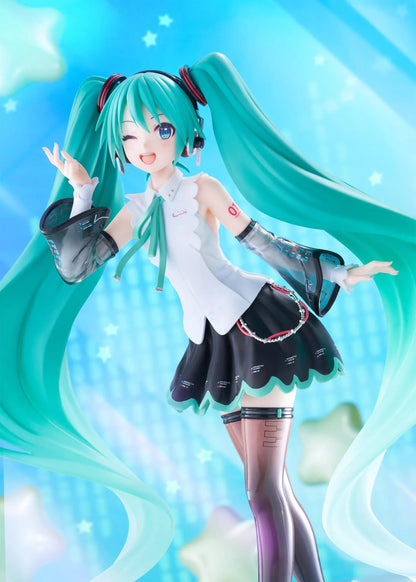 Vocaloid T-Most Hatsune Miku NT Ver. Figure featuring Miku with long teal twin tails, headphones, black-and-white outfit, wink expression, peace-sign pose, and star-themed base.
