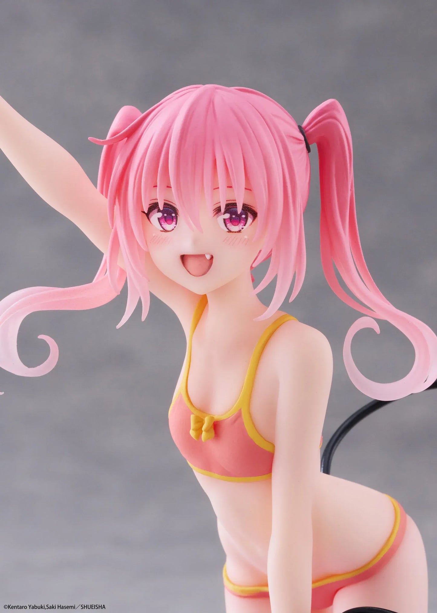 To Love-Ru Darkness Aqua Float Girls Nana figure featuring Nana with pink twin tails in a swimsuit posing on a purple float ring display base