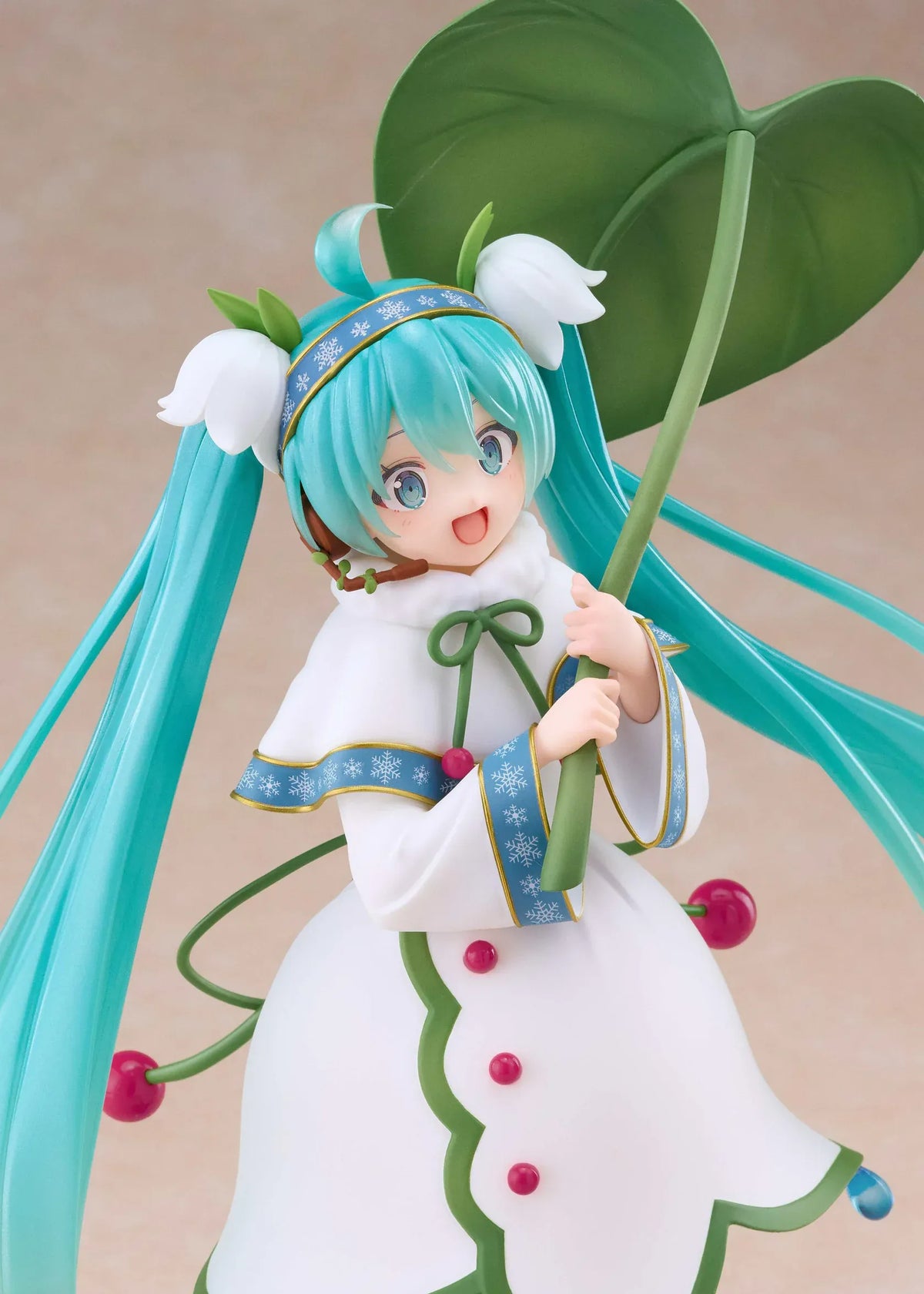 Snow Miku All Stars 2015 Ver. AMP+ figure wearing a white flower-inspired dress and holding an oversized green leaf.