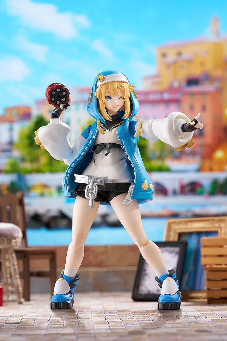 GUILTY GEAR STRIVE figma Bridget Figure featuring Bridget in a blue hoodie outfit with yo-yo accessory, oversized handcuff detail, and teddy bear companion.