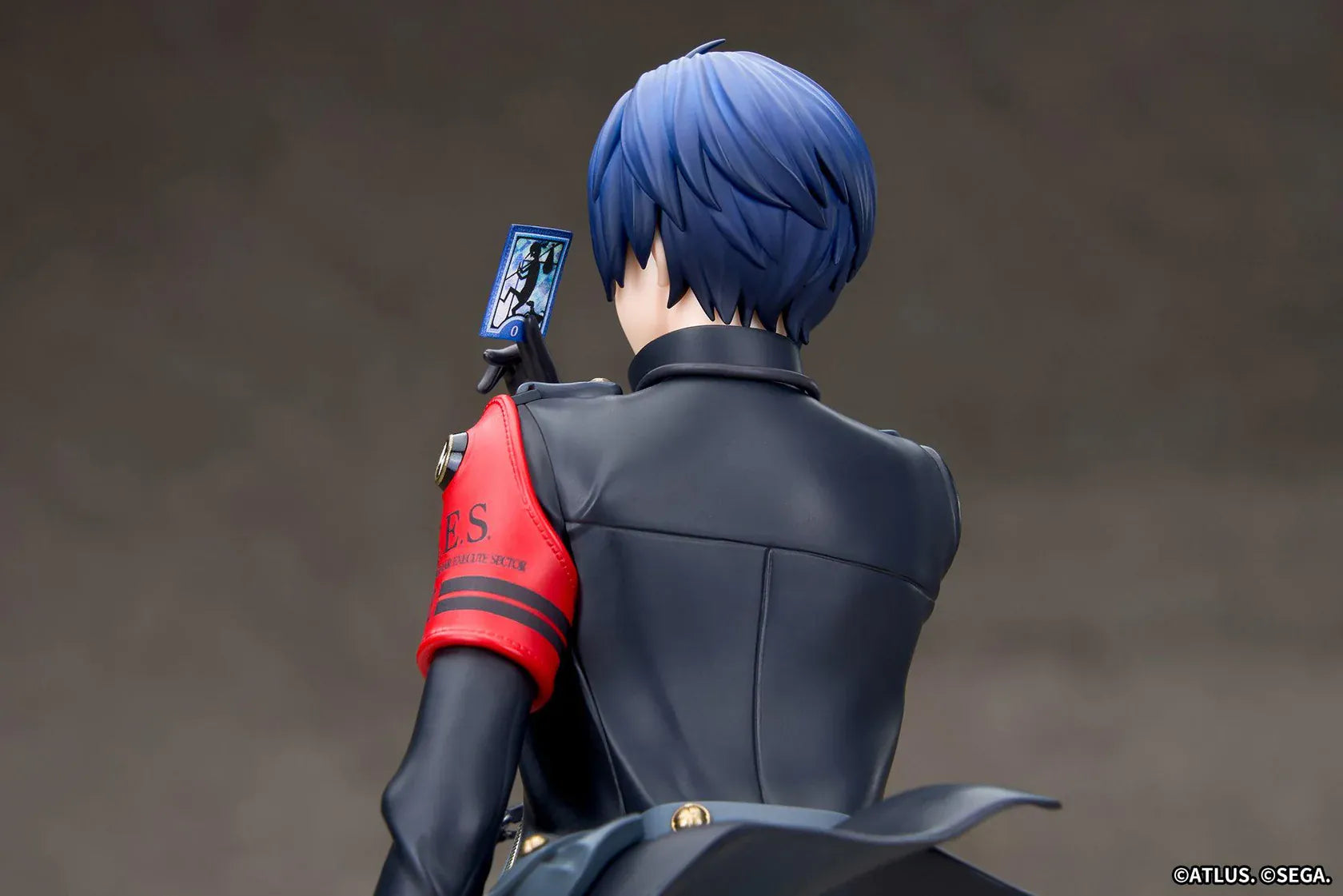 Persona 3 Reload Limepie Protagonist 1/8 Scale Figure with blue hair, black jacket, S.E.E.S. armband, headphones, and themed display base