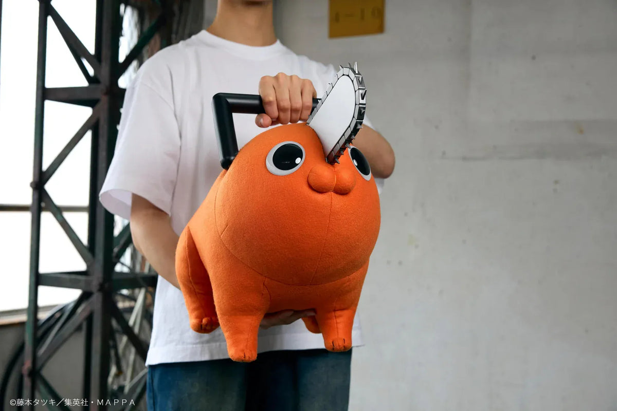 Chainsaw Man life-size Pochita doll figure with an orange body, glossy eyes, chainsaw blade, black handle, and pull cord.
