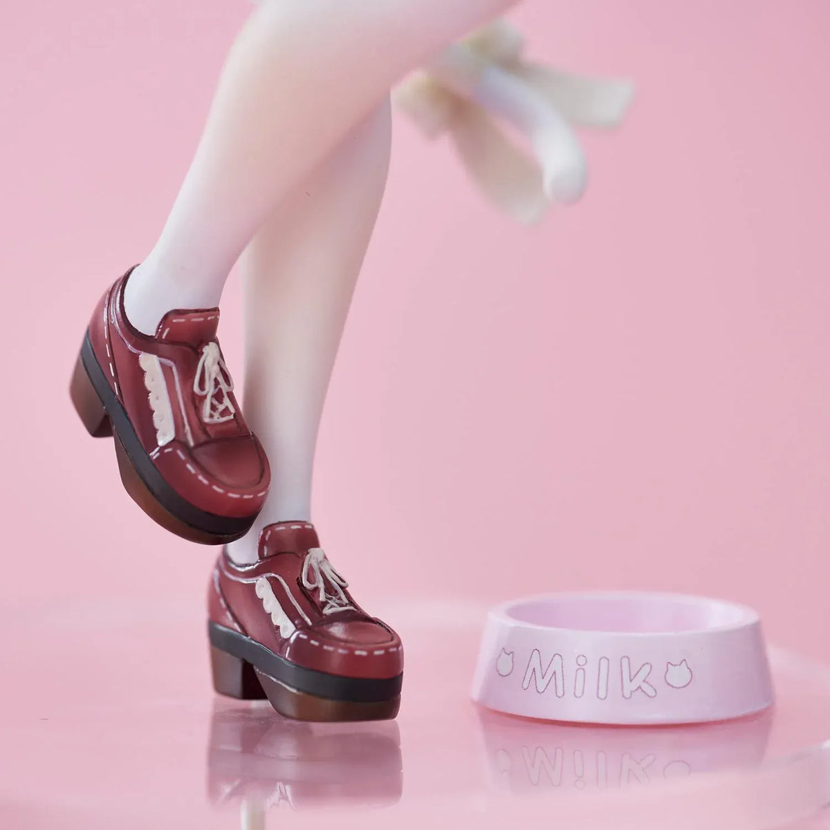 Super Sonico White Cat Ver. figure with pink hair, cat ears, glasses, blue jacket, white outfit, and milk bowl on a clear base.