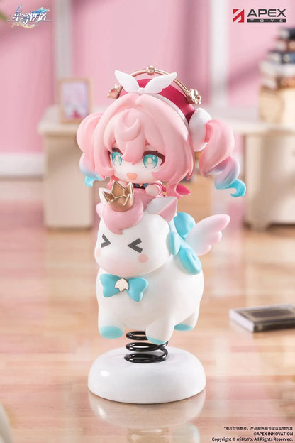 Honkai Star Rail Happy Shake Hyacine Non-Scale Figure by APEX Toys featuring a pink-haired anime girl with turquoise eyes riding a white winged companion with a golden crown and blue bow, mounted on a black spring and white circular base.