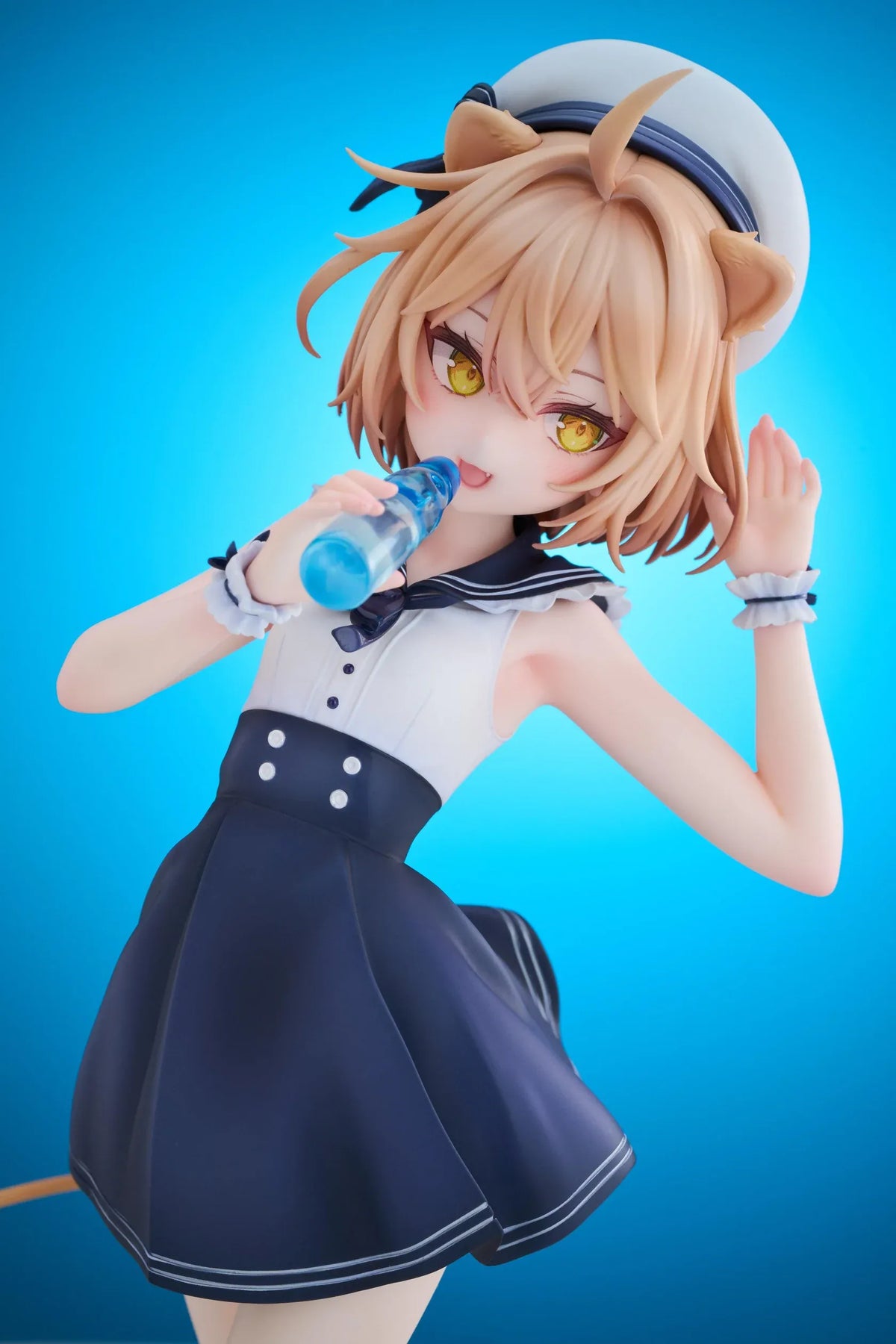 Rurudo Lion Marine Sailor Ver. figure in a navy and white sailor dress and hat, holding a blue bottle beside a chibi lion companion.