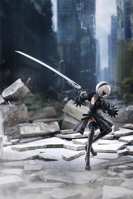 NieR Ver1.1a figma 2B figure with silver hair, a black visor, patterned black outfit, white sleeves, glossy boots, and a support robot.
