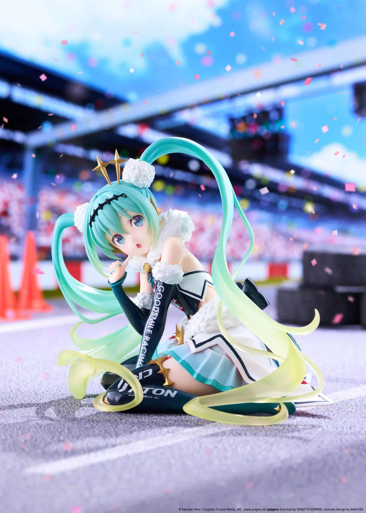 Racing Miku 2018 Ver. Round 8 figure seated in a white, black, and turquoise racing outfit with long gradient twin tails.