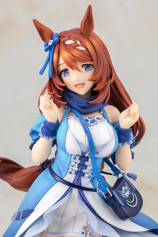 Uma Musume Pretty Derby Super Creek 1/7 Scale Figure featuring Super Creek in a blue-and-white outfit with red hair, horse ears, tail, and a cheerful pose on a themed base.