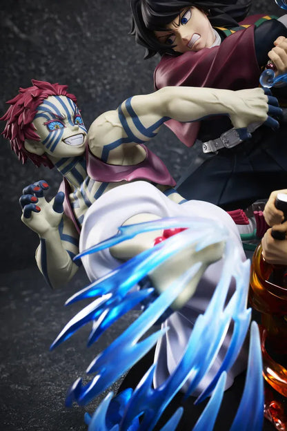 Demon Slayer Tanjiro Kamado, Giyu Tomioka, and Akaza vignette figure featuring translucent water and fire battle effects.