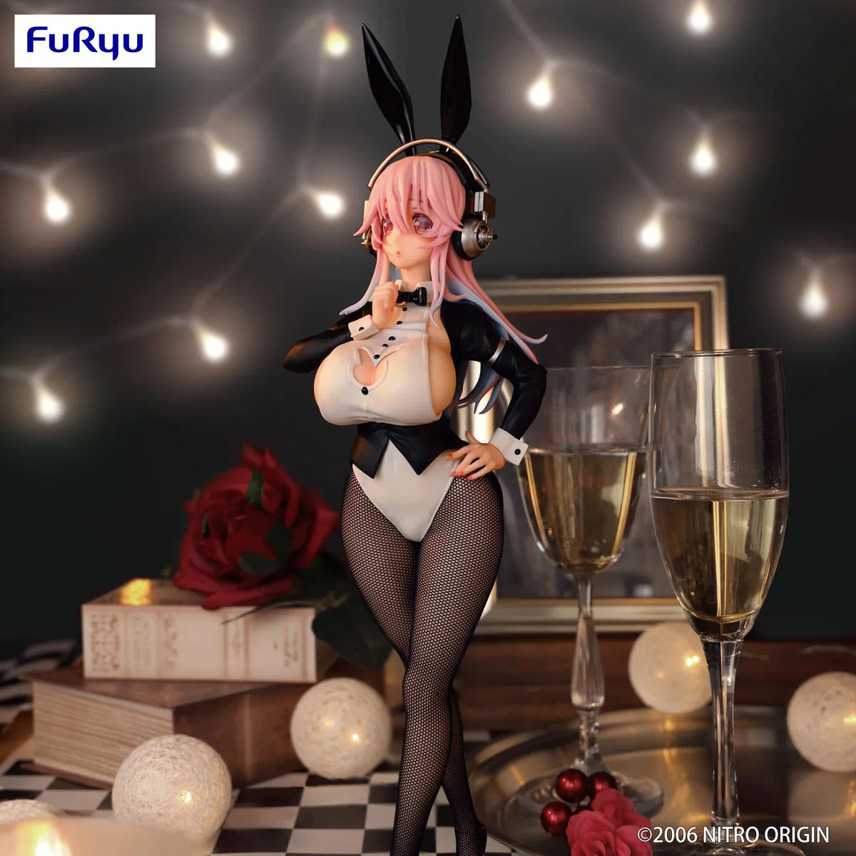 Super Sonico Tailcoat Ver. figure with pink hair, silver headphones, black bunny ears, a black and white outfit, and patterned stockings.