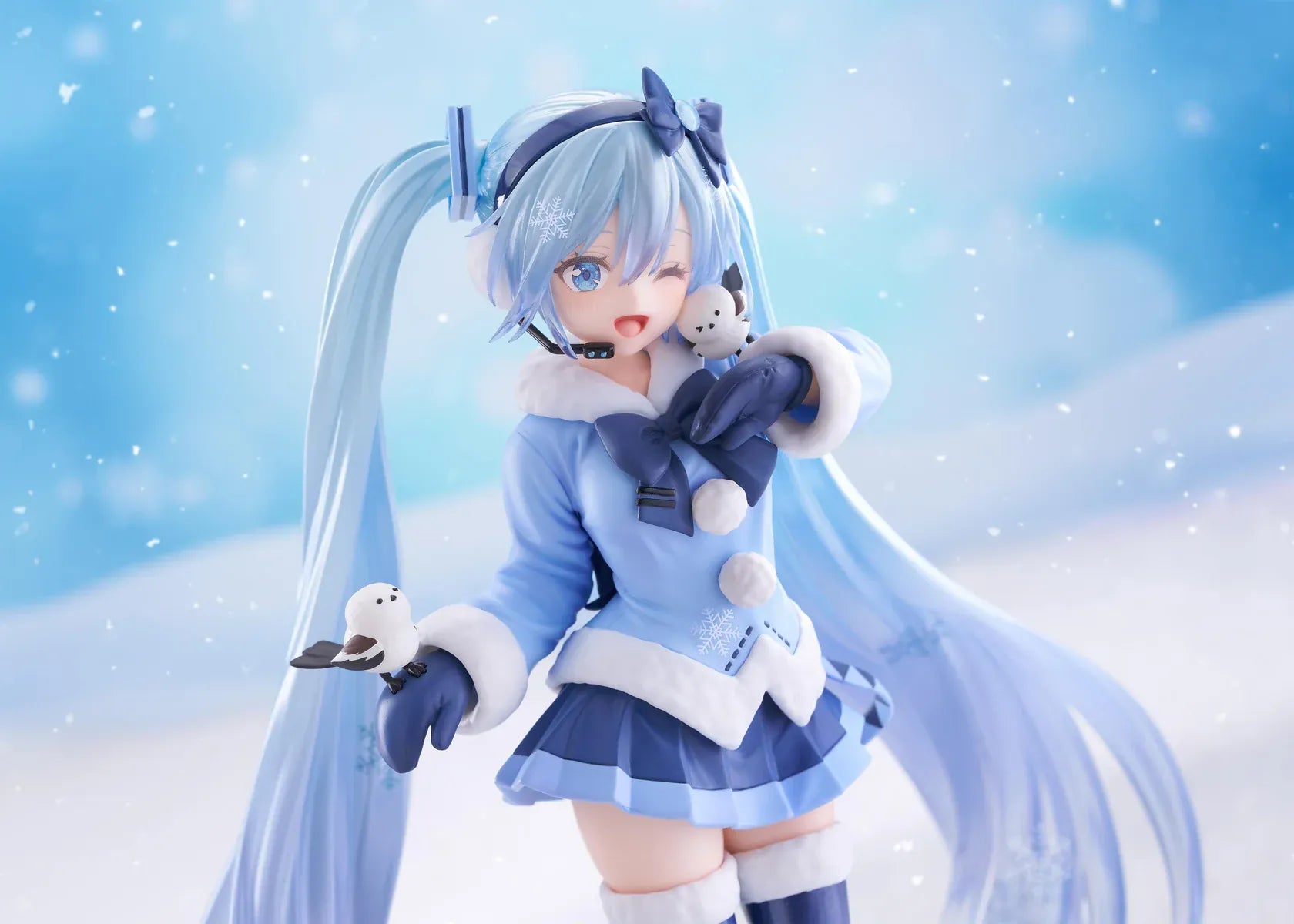 Vocaloid AMP+ Snow Miku All Stars 2012 Ver. Figure with icy blue twin-tails, winter outfit, bird details, and snowflake display base
