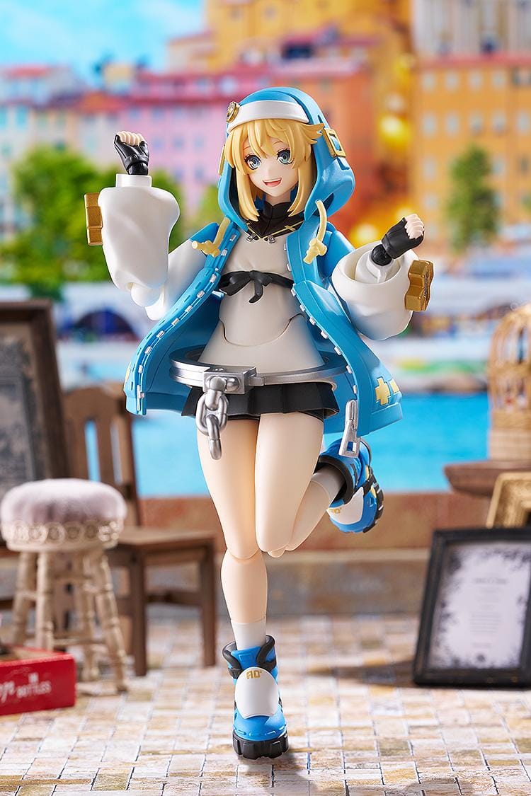 GUILTY GEAR STRIVE figma Bridget Figure featuring Bridget in a blue hoodie outfit with yo-yo accessory, oversized handcuff detail, and teddy bear companion.