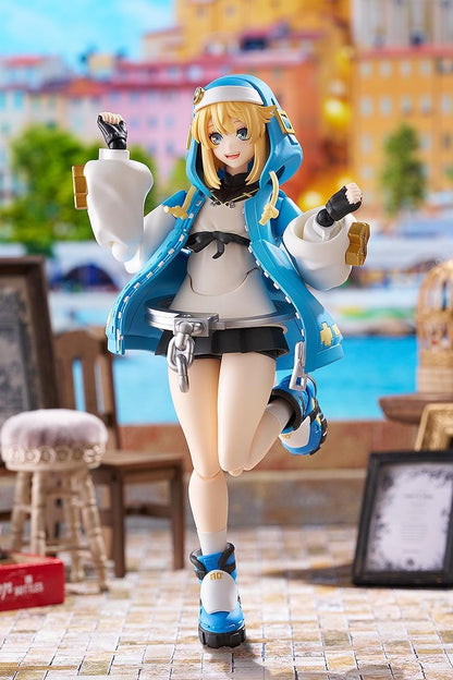 GUILTY GEAR STRIVE figma Bridget Figure featuring Bridget in a blue hoodie outfit with yo-yo accessory, oversized handcuff detail, and teddy bear companion.