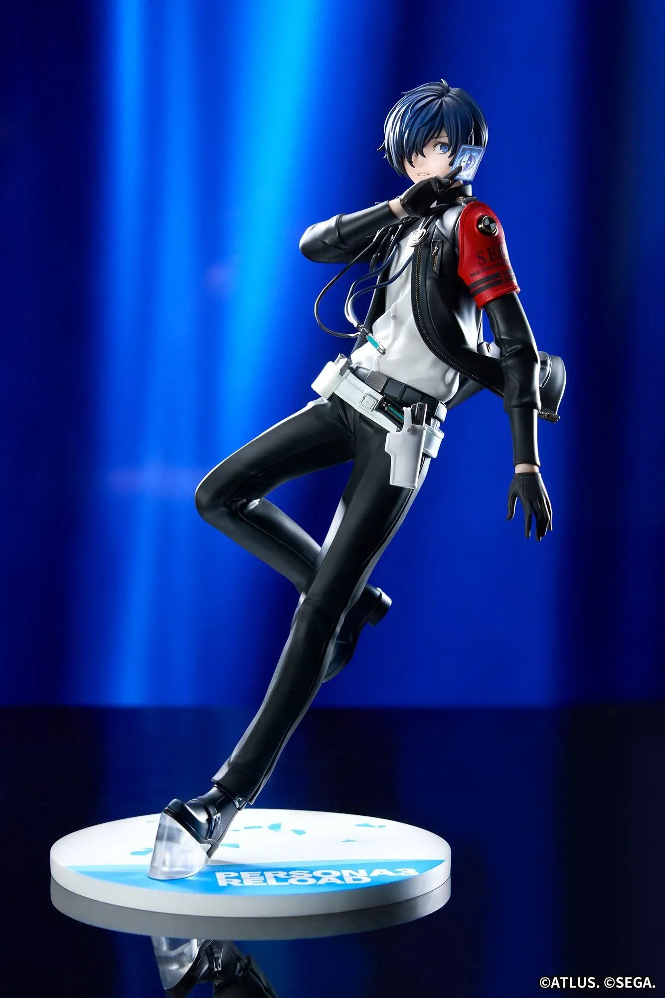 Persona 3 Reload Limepie Protagonist 1/8 Scale Figure with blue hair, black jacket, S.E.E.S. armband, headphones, and themed display base