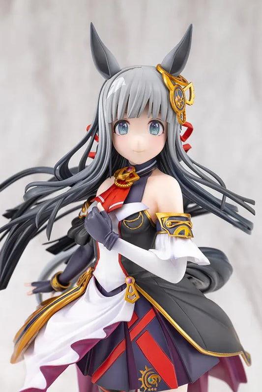 Umamusume Pretty Derby Chrono Genesis 1/7 Scale Figure featuring a silver-gray-haired horse girl with blue eyes, horse ears, and a flowing white, black, red, and gold racing outfit standing on a grassy display base.