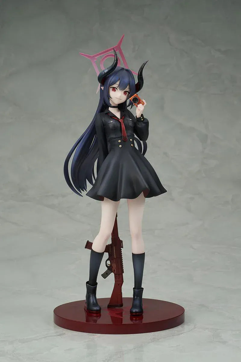 Blue Archive Chiaki 1/7 scale figure wearing dark uniform with long coat holding camera and rifle accessory.