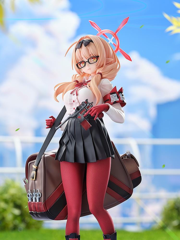 Blue Archive Chinatsu 1/7 Scale Figure featuring Chinatsu with pink hair, glasses, red gloves, halo detail, weapon accessory, and a large bag.