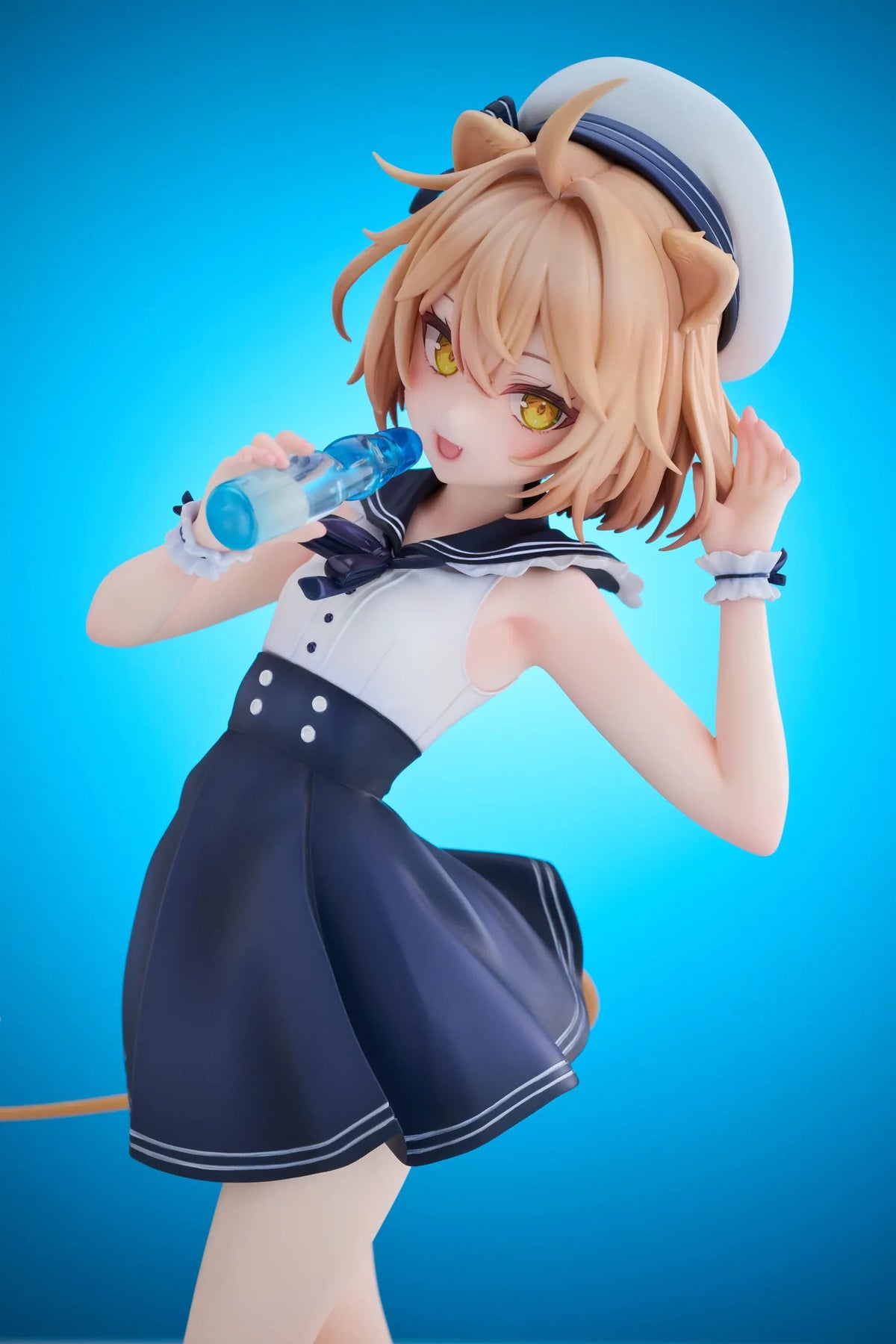 Rurudo Lion Marine Sailor Ver. figure in a navy and white sailor dress and hat, holding a blue bottle beside a chibi lion companion.