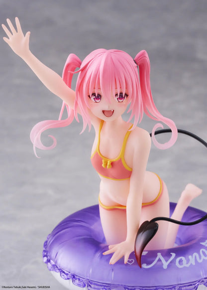 To Love-Ru Darkness Aqua Float Girls Nana figure featuring Nana with pink twin tails in a swimsuit posing on a purple float ring display base