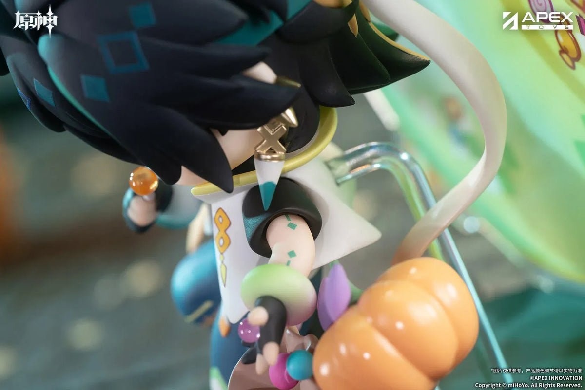 Genshin Impact You Ye Qi Xiang Series chibi Kinich figure holding a lollipop, surrounded by candy, a pumpkin, and a pixel-art backdrop.