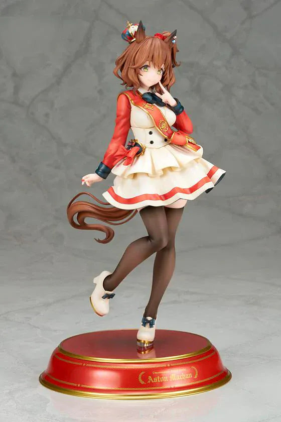 UmaMusume Pretty Derby Aston Machan 1/7 Scale Figure featuring Aston Machan with horse ears, short brown hair, red-and-cream outfit, plush doll accessory, and themed display base.