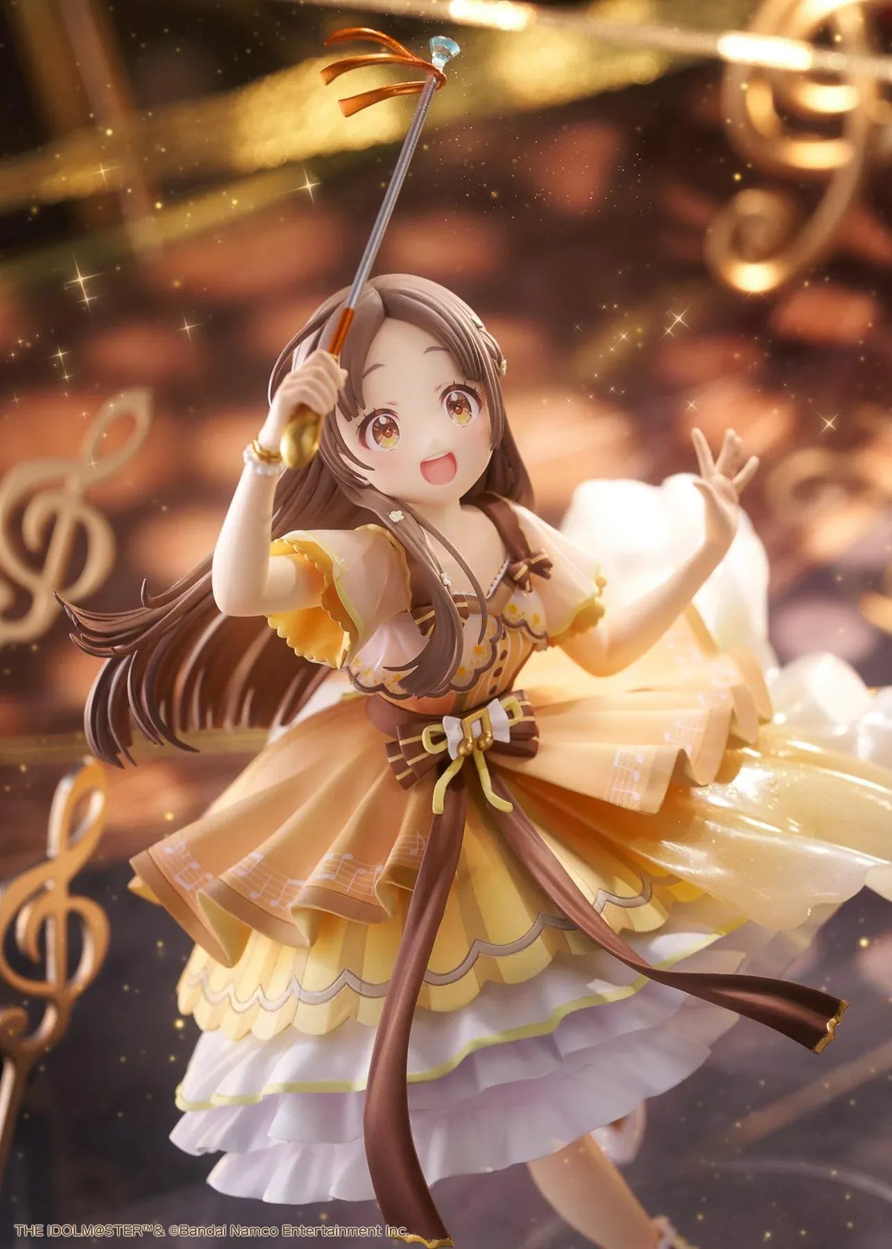 The Idolmaster Gakuen China Kuramoto 1/7 scale anime figure in a flowing yellow stage dress holding a microphone