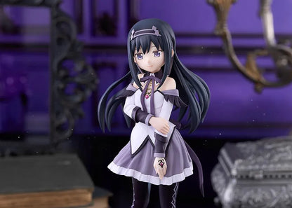 Homura Akemi figure with long black hair, violet eyes, a white and purple outfit, and diamond-patterned stockings, smiling with one hand resting on her arm.