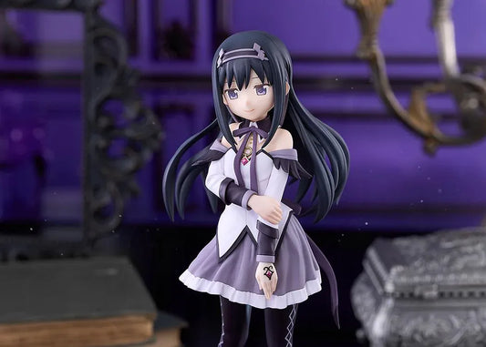 Homura Akemi figure with long black hair, violet eyes, a white and purple outfit, and diamond-patterned stockings, smiling with one hand resting on her arm.