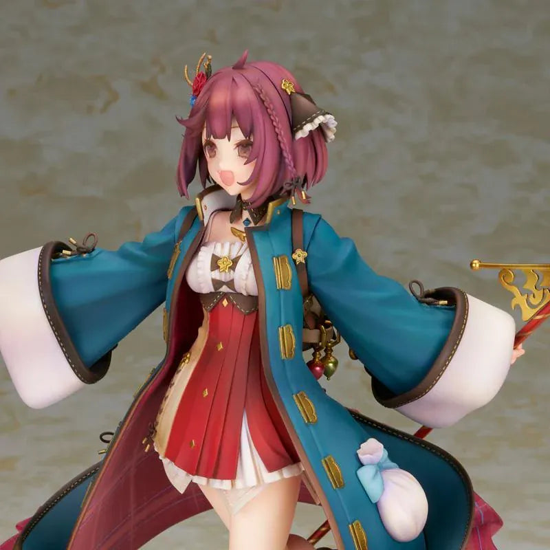 Sophie Neuenmuller figure smiling in a dynamic pose, wearing a teal coat over a red outfit and holding an ornate gold staff with a red orb.