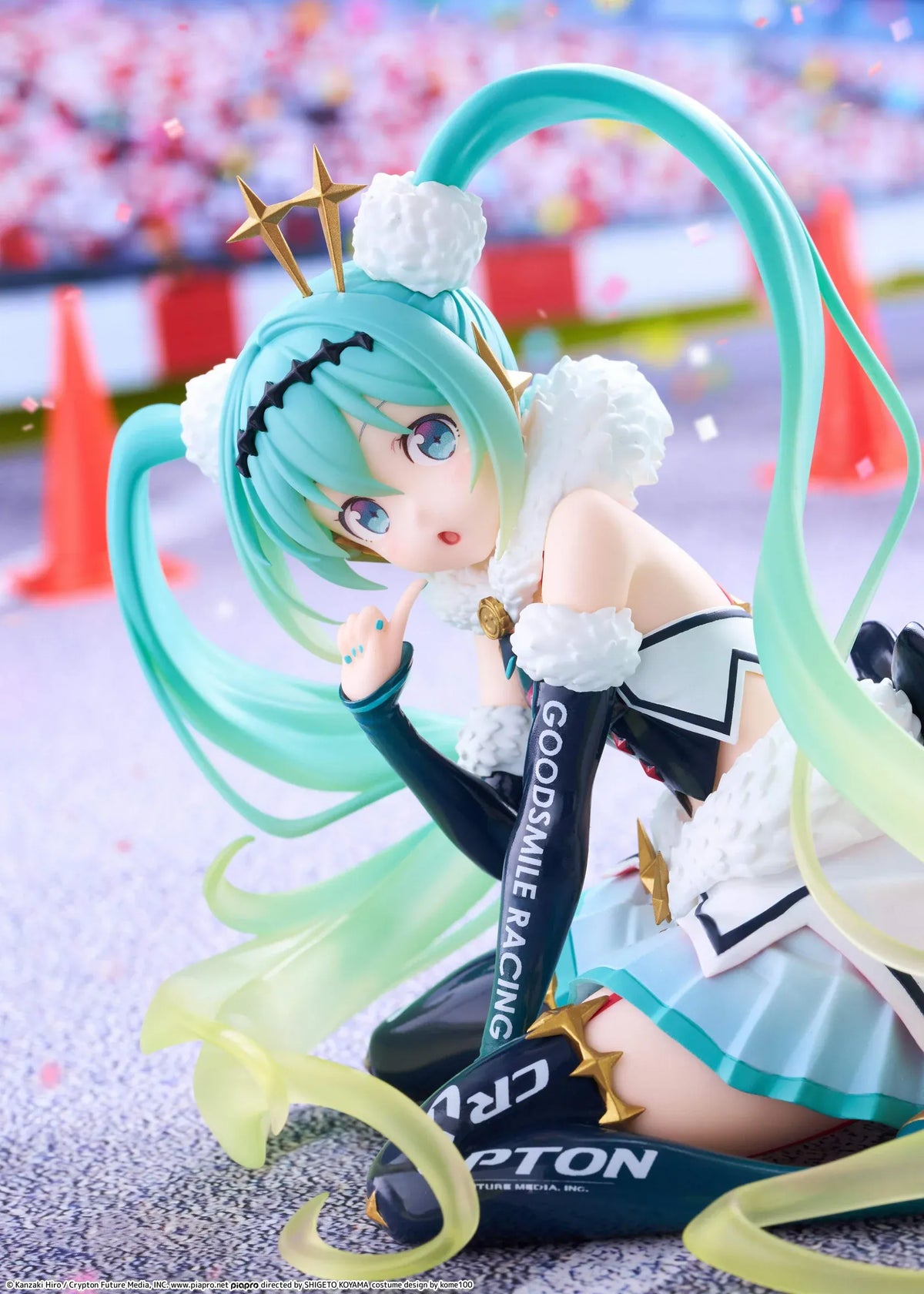 Racing Miku 2018 Ver. Round 8 figure seated in a white, black, and turquoise racing outfit with long gradient twin tails.