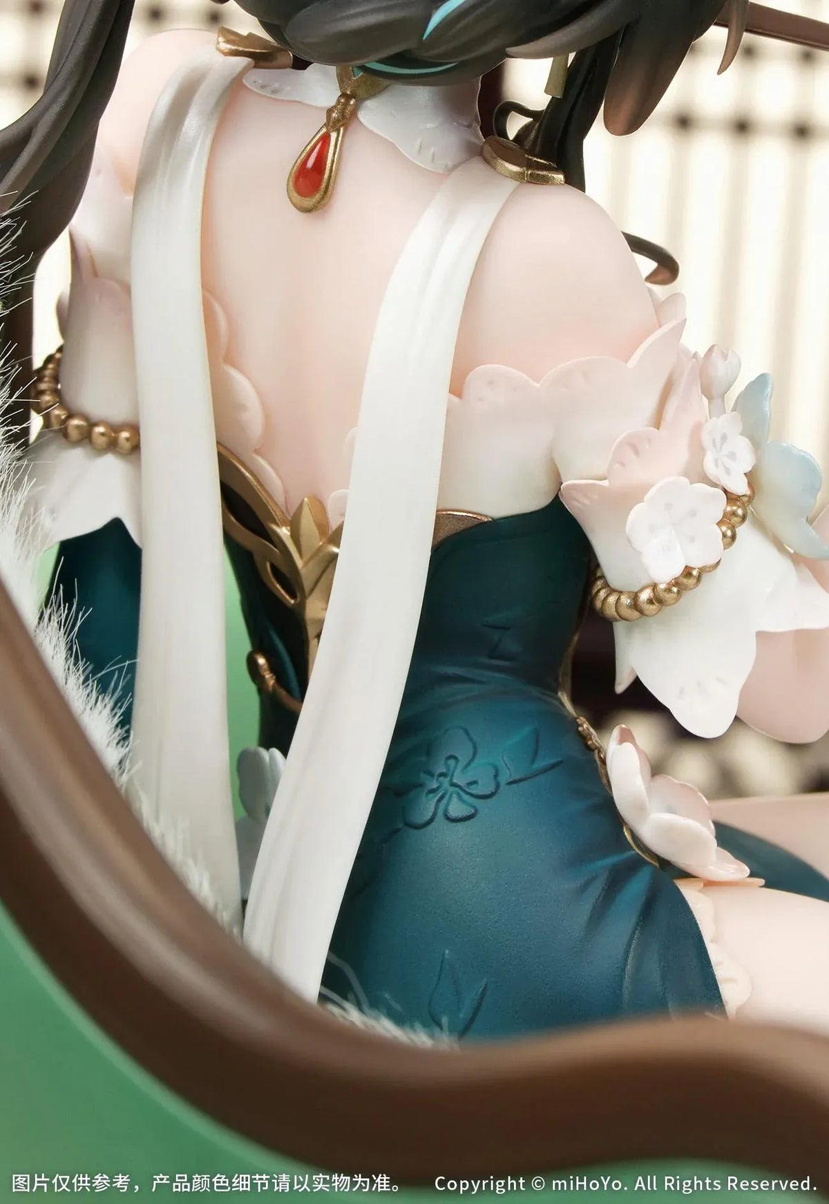 Ruan Mei Plumblossom Letter 1/7 scale figure wearing an elegant teal-and-white floral dress while seated on an ornate green sofa.