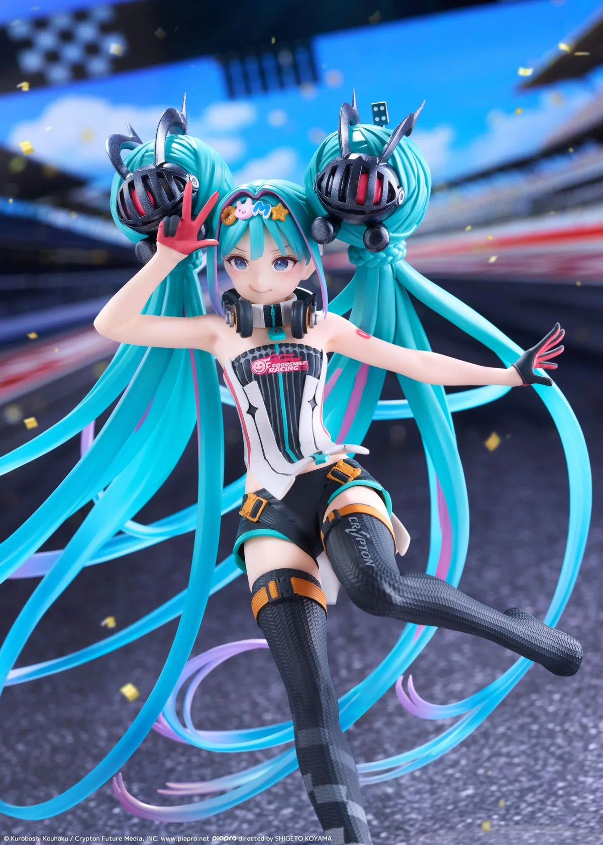 Hatsune Miku Taito Kuji Racing Miku 2026 figure wearing a futuristic racing outfit with flowing turquoise twin-tails and headphones.