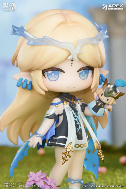 Chibi Cartethyia Jinseki Series figure with blonde hair, blue eyes, a pale blue headpiece, and a small armored companion, standing on a green floral base.