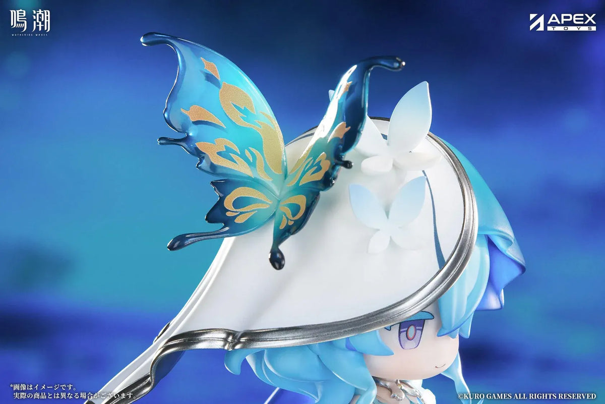 Chibi Shorekeeper Jinseki Series figure with blue hair, a butterfly-decorated headpiece, and a blue butterfly held in her hands, standing on a water-inspired base.