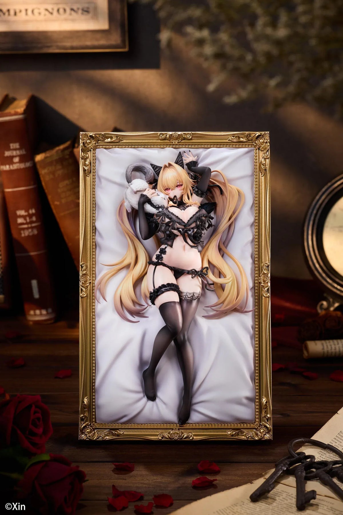 Stella Black Cat Ver. Deluxe Edition 1/7 Scale Figure illustrated by Xin, featuring a blonde-haired catgirl with red eyes, black lace lingerie, cat ears, and thigh-high stockings displayed in an ornate golden frame with a matching illustrated wall scroll.