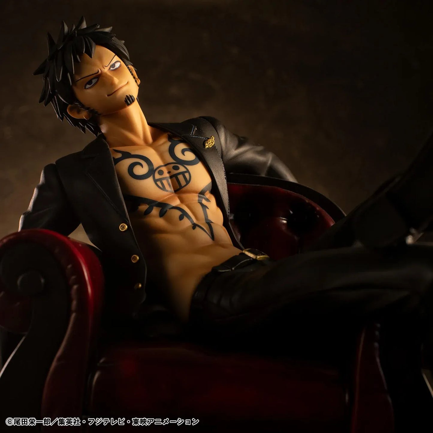 One Piece Portrait Of Pirates S.O.C. Trafalgar Law Ver. R Figure wearing a black suit and sitting in a red armchair
