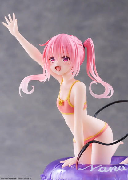 To Love-Ru Darkness Aqua Float Girls Nana figure featuring Nana with pink twin tails in a swimsuit posing on a purple float ring display base