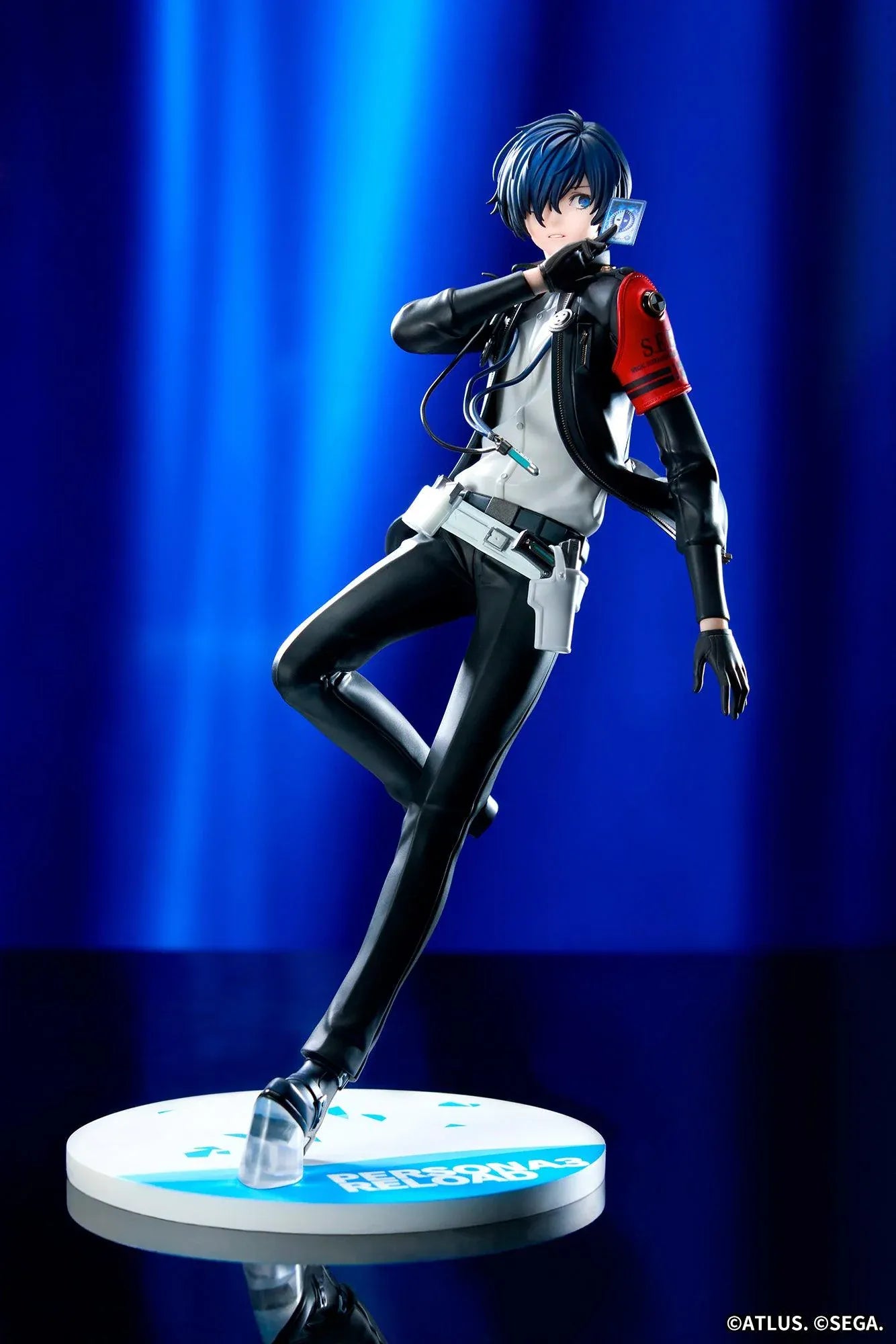 Persona 3 Reload Limepie Protagonist 1/8 Scale Figure with blue hair, black jacket, S.E.E.S. armband, headphones, and themed display base
