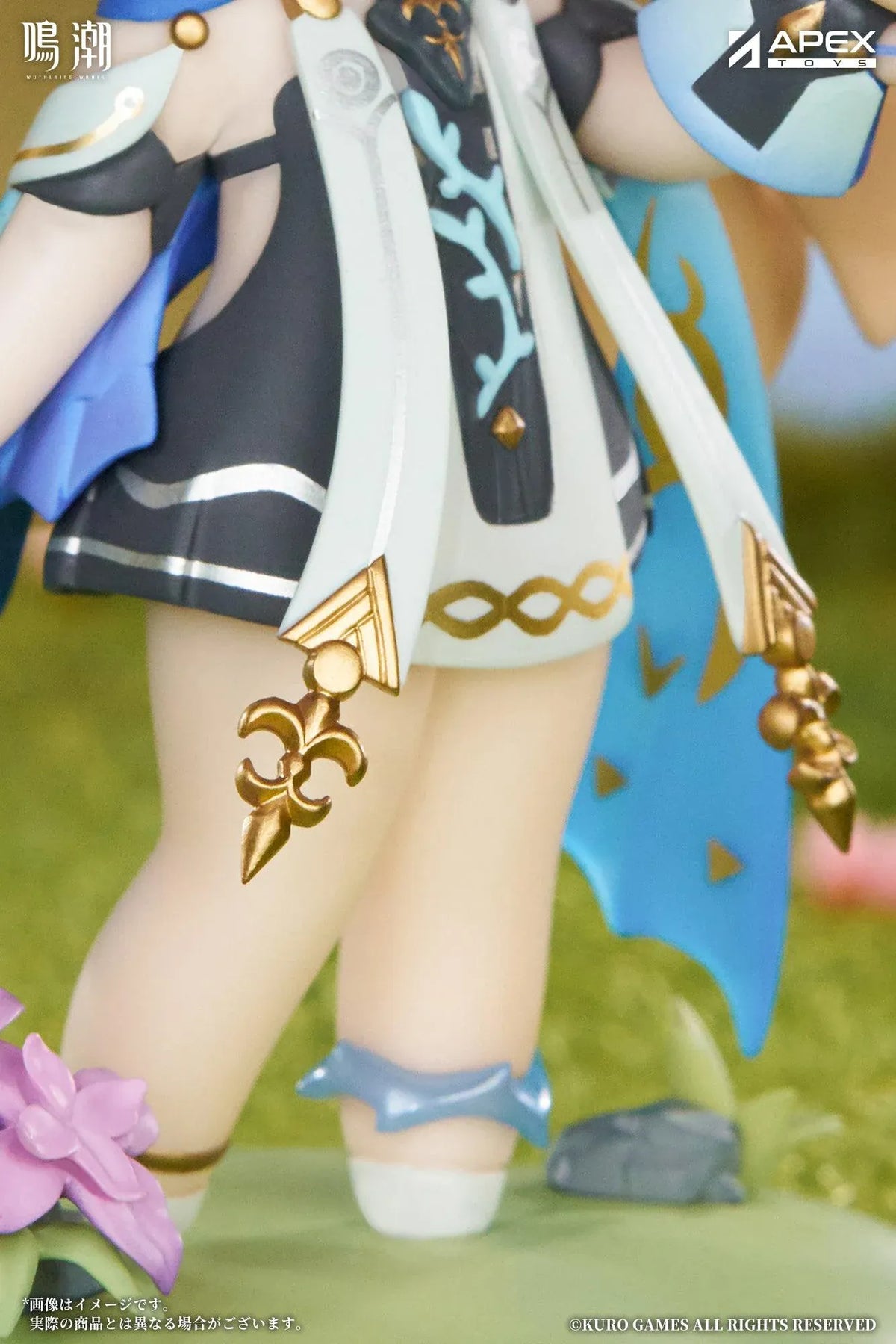 Chibi Cartethyia Jinseki Series figure with blonde hair, blue eyes, a pale blue headpiece, and a small armored companion, standing on a green floral base.